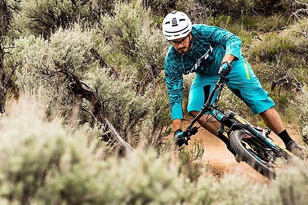 Mountain biker turning sharply through a corner